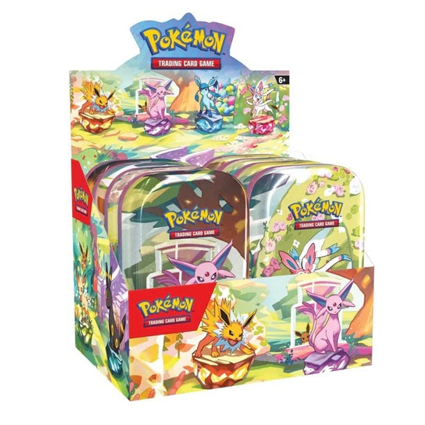 Pokémon trading card game packaging with colorful designs and character illustrations.