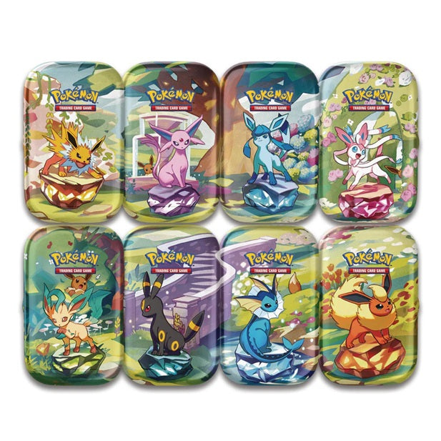 Set of eight colorful Pokémon trading card game tins on a white background
